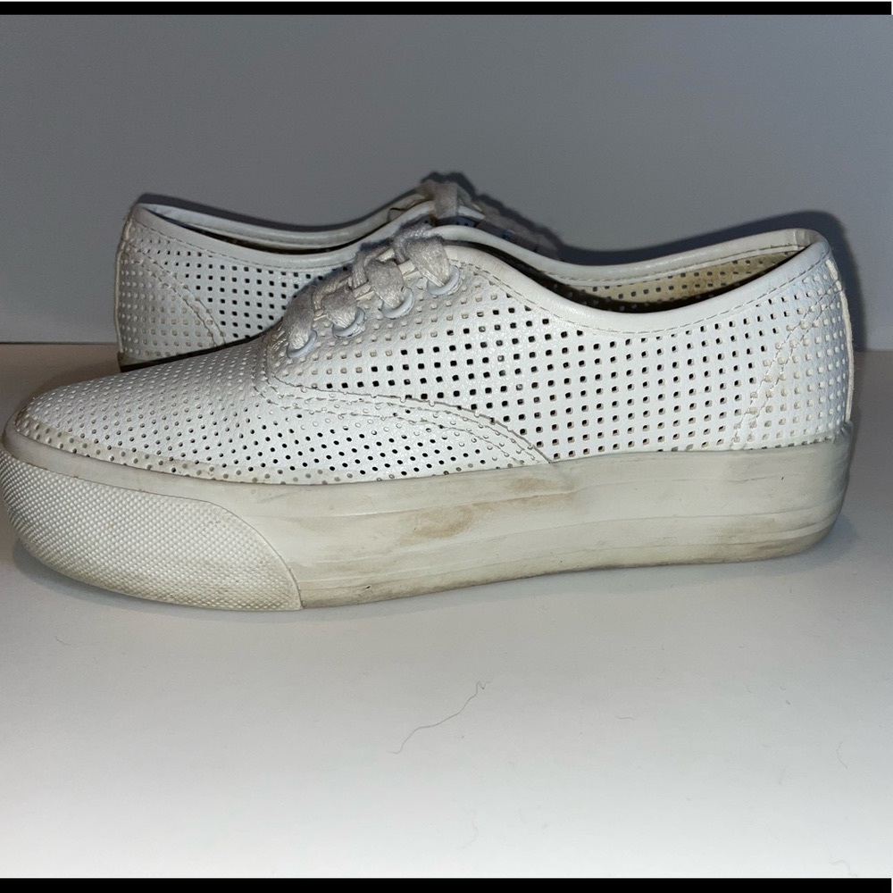 White leather-style platform sneaker with holes